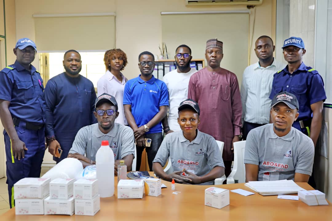 Mozuk Futures Solutions with Fidelity Bank Plc commemorates World Blood Donor Day in Abuja Pic.i. Chief Security Officer, Fidelity Bank Plc, Okpanachi Alfred (back row, L); Operations Manager, Mozuk Healthcare Group, Ekundayo Oyewole (front row, L); Laboratory Technician, Mozuk Future Solutions (MFS), Esther Bitrus (front row, M); Product Manager of MFS, Harry Omoakhia (front row, R) and other participant's, during the awareness campaign on voluntary blood donation as part of the activities to mark the World Blood Donor Day organisesd by Mozuk Future Solutions in collaboration with the Fidelity Bank Plc , in Abuja. 14/6/2025/Jimah Suleman/NAN