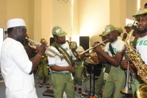 Minister of Youth Development, Comrade Ayodele Olawande (L); with the members of the National Youth Service Corps (NYSC), entertaining the guest during the 2025 Africa/ National Youth Day celebration organised by the FMYD in collaboration with Mind the_Gap in Abuja on Thursday (27/11/25).