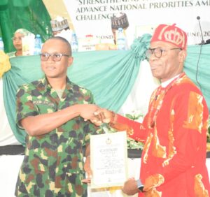 Director-General, National Youth Service Corps (NYSC), Brig.-Gen. Olakunle Nafiu (L); presenting retirement certificate to the Director of Audit, NYSC, Dr Levi Agim, as he retired today during the NYSC 2026 Batch B Pre-orientation Workshop in Abuja on Tuesday (2/6/26). /TUE/JUNE/2/2026/Deborah Bada/NAN 