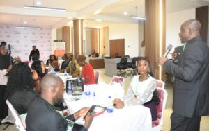 Executive Director,  Mind the Gap Foundation, Mr Tayo Olosunde (R), addresing the participants during a technical review of a desk report on Young Nigerians Not in Education, Employment or Training (Y-NEET), organised by Mind the_ Gap Foundation in Abuja on Wednesday (10/6/26).WED/JUNE/10/2026/Deborah Bada/NAN