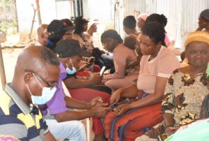 Health workers attending to the people of new kuchingoro Internally Displaced Persons (IDPs), during a free medical outreach organised by Oneworld Initiative for sustainable development in collaboration with National Commission for Refugees, Migrants and Internally Displaced Persons in Abuja on Thursday