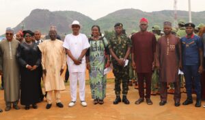 Representative of the Minister of State for FCT, Mr Istifanus Luka (3rd L); FCT Coordinator, National Youth Service Corps (NYSC), Mr Samson Ateli (4th L); Camp Director, NYSC, Mrs Abosede Fashina (M); and others during the swearing-in of 2026 NYSC Batch B stream I orientation course at the Kubwa orientation camp in Abuja Monday (15/6/26).000/JUNE/15/2026/Deborah Bada/NAN 
