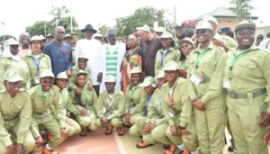 Representative of the Minister of State for FCT, Mr Istifanus Luka (5th L); FCT Coordinator, National Youth Service Corps (NYSC), Mr Samson Ateli (4th L); and other NYSC staff and Corps members during the swearing-in of 2026 NYSC Batch B stream I orientation course at the Kubwa orientation camp in Abuja.